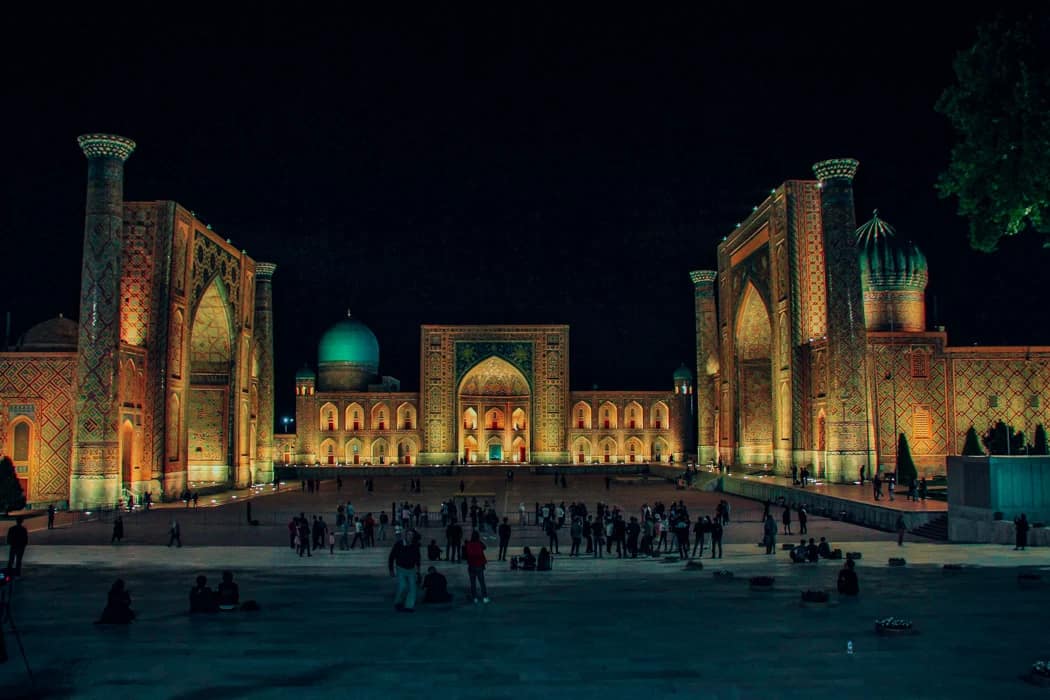 Registan Square illuminated at night in Samarkand Uzbekistan