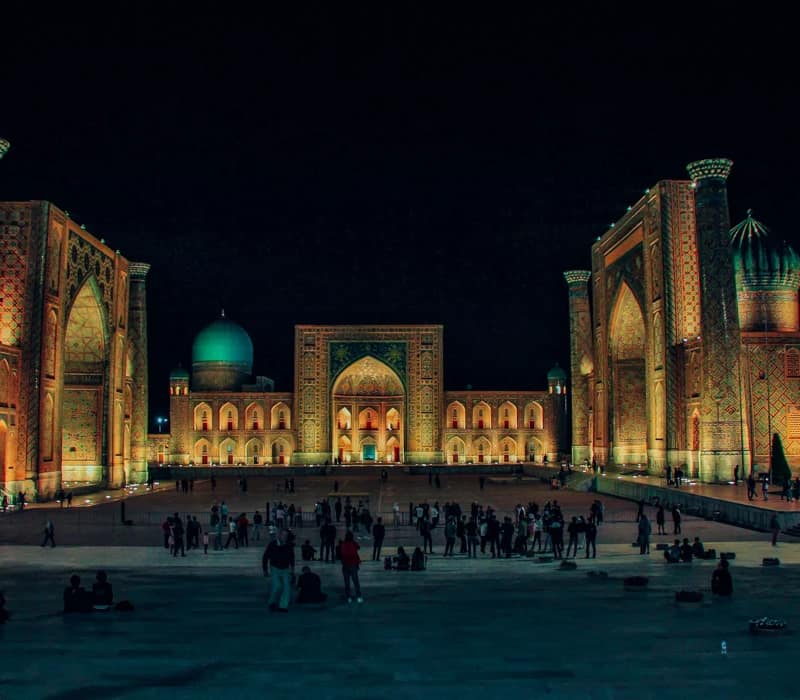 Registan Square illuminated at night in Samarkand Uzbekistan